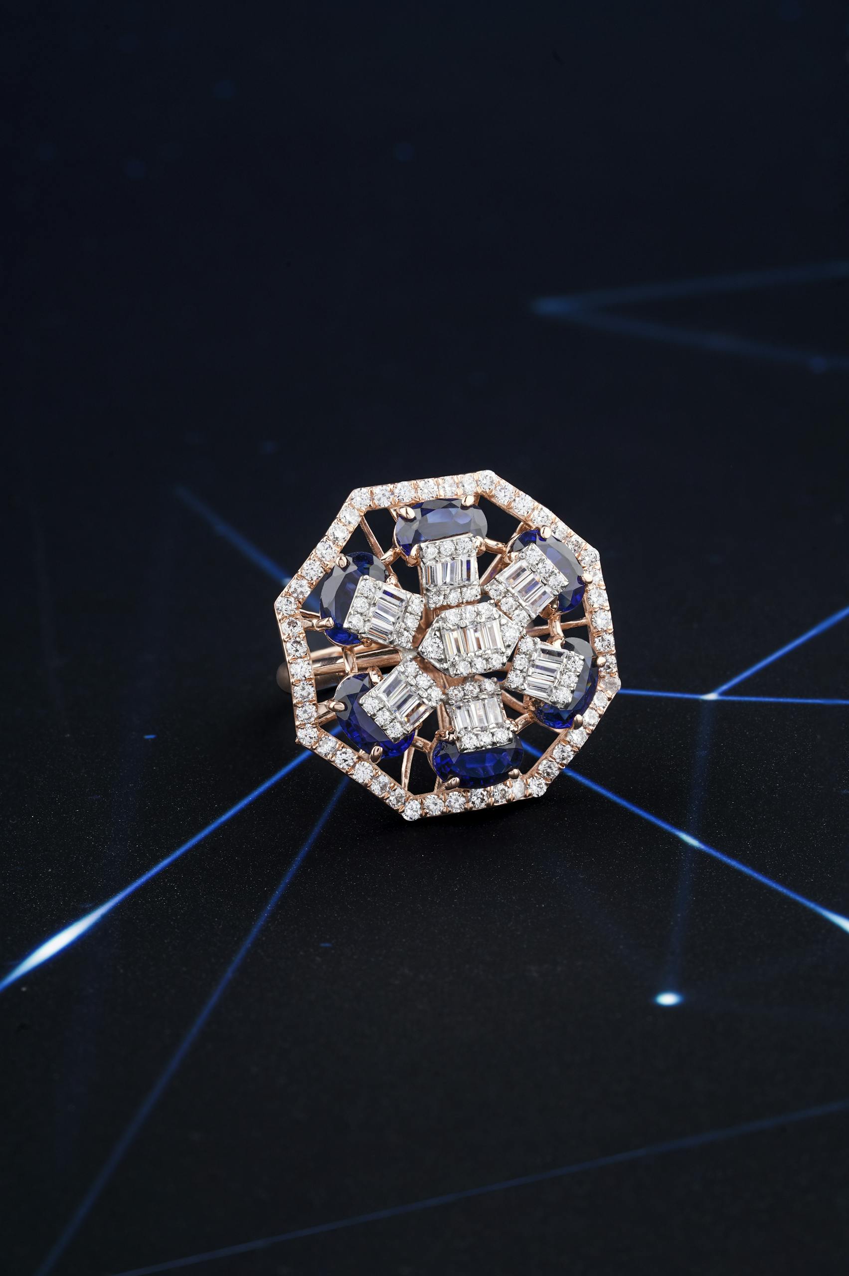 Close-Up Shot of a Diamond Ring on Blue Surface